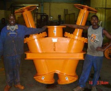 Workers with the finished Dual Valve Product